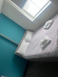 a small bed in a room with a window at Mapperley House - UNDER NEW MANAGEMENT PROMOTIONAL RATES AVAILABLE in Nottingham