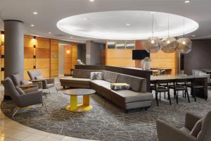 a lobby with a couch and chairs and a table at SpringHill Suites Knoxville At Turkey Creek in Knoxville