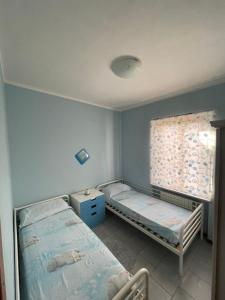 Katil atau katil-katil dalam bilik di Alloggio Flaminia con parcheggio di proprietà!