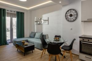 a living room with a couch and a table at Pap's Lab Apartments in Heraklio