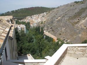 a view from the balcony of a building on a mountain at Alojamientos Turísticos Casco Antiguo in Cuenca