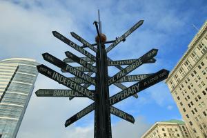 a street sign with many signs pointing in different directions at Courtyard by Marriott Portland City Center in Portland