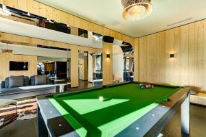 a living room with a pool table at La Cordee 331 Apartment in Chamonix-Mont-Blanc