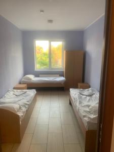 Кровать или кровати в номере Green-Hotel