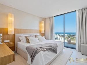 Voodi või voodid majutusasutuse Ático De Lujo Con Jacuzzi En Higuerón West toas