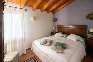 Postel nebo postele na pokoji v ubytování Agriturismo Terre Bianche