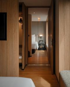 a hotel room with a bed and a bedroom at Homm Sukhumvit34 Bangkok in Bangkok
