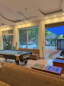 a living room with a pool table and a couch at Ninh Binh Central Backpackers hostel in Ninh Binh