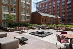 a patio with tables and chairs and a fire pit at Residence Inn by Marriott Washington Downtown/Convention Center in Washington