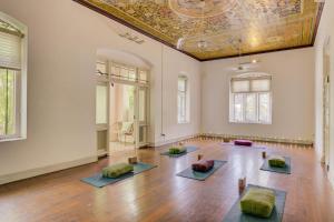 an empty room with four meditation mats on the floor at Prana Home in Colombo