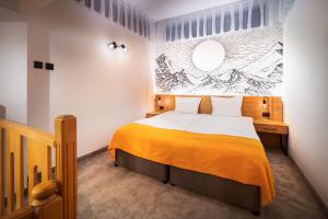 Uma cama ou camas num quarto em Hotel Alfaresort Thermal Chiflika
