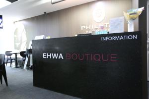 a sign for an emiya boothure at an event at Philstay Ehwa Boutique - Female Only in Seoul