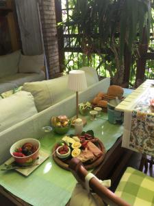 a table with a tray of food on top of a couch at B&B Cosi fan Tutte in Desenzano del Garda