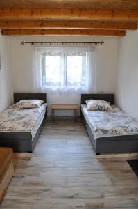 Una cama o camas en una habitación de Agroturystyka u Hani