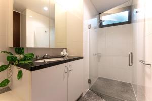 A bathroom at Waves 1 Hamilton Island - Ocean Views and buggy
