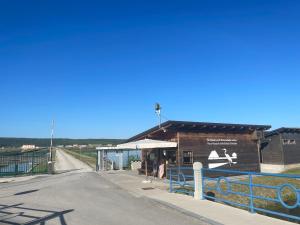a building with a bus stop next to a road at APARTMENTS EDWINA in Portorož +6 photos