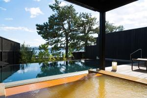 a swimming pool in the middle of a house at HOSHINO-OTOー星音 in Miyazu