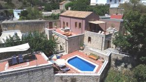 an aerial view of a house with a swimming pool at Villa Irini in Vafés