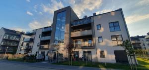 a large white building with a lot of windows at Victoria Garden in Tarnowo Podgórne