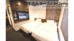 Cama o camas de una habitación en Henn na Hotel Tokyo Akasaka