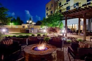 a fire pit in the middle of a patio at night at Courtyard Statesville Mooresville/Lake Norman in Statesville