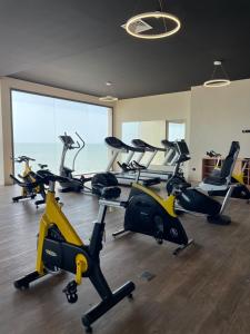 a gym with a bunch of exercise bikes in a room at Tulum Beach Resort Dakhla in Dakhla
