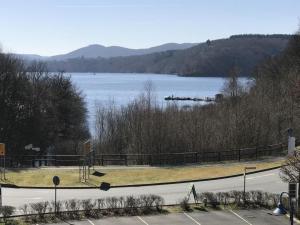 a view of a lake with a dock in the water at Ferienwohnung-Seeblick-Edersee in Waldeck