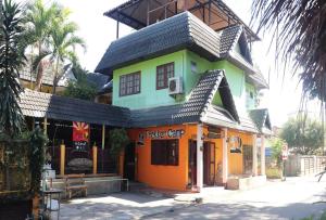 a building with a roof on top of it at Trekker Camp in Chiang Mai