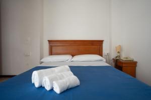 Postel nebo postele na pokoji v ubytování Hotel Napoleon