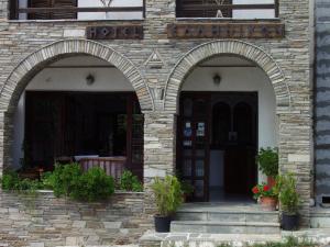 an entrance to a building with two arched doors at Hotel Hellinikon in Ouranoupoli