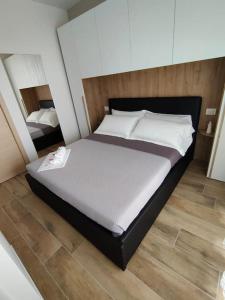Säng eller sängar i ett rum på G.N.F. sea apartament