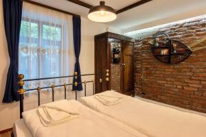 Postel nebo postele na pokoji v ubytování The House with the Bell/Къщата с камбанката