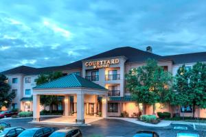 a hotel front view of a hotel with a parking lot at Courtyard by Marriott Wichita East in Wichita