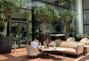 two people sitting at tables in a restaurant at Address Istanbul in Istanbul