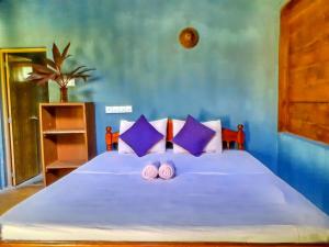 Voodi või voodid majutusasutuse Neem Jay Beach Resort toas