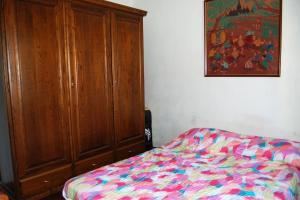 Ein Bett oder Betten in einem Zimmer der Unterkunft Casa Patrizia, Bagni di Lucca