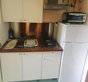 Kuchyň nebo kuchyňský kout v ubytování HomeSweetHome Dervio