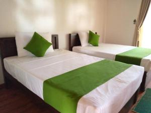 Letto o letti in una camera di KayJay Palms