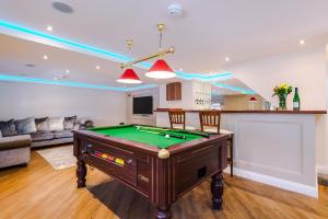 a living room with a pool table in it at Unique 2-bed barn in Beeston by 53 Degrees Property, ideal for Families & Friends, Great Location - Sleeps 4 in Beeston