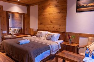 A bed or beds in a room at THE CONIFER