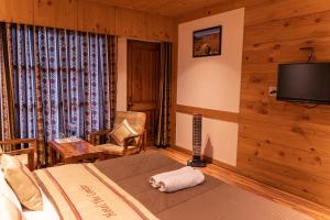 A bed or beds in a room at THE CONIFER