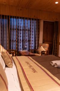 A bed or beds in a room at THE CONIFER