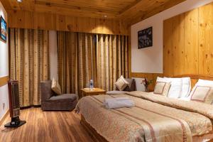 A bed or beds in a room at THE CONIFER