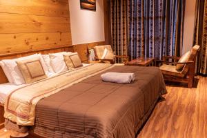 A bed or beds in a room at THE CONIFER