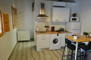 Kuchyň nebo kuchyňský kout v ubytování Apartamento AstaRegia