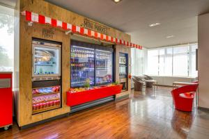 a grocery store with a soda machine in a room at ibis Berlin Messe in Berlin