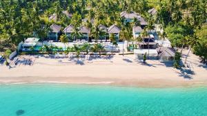 an aerial view of a resort on a beach at Seven Secrets by Hanging Gardens in Senggigi