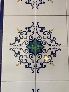 a tile floor with a blue and white pattern on it at Bed & Breakfast Casa Anna Rita in Vietri sul Mare