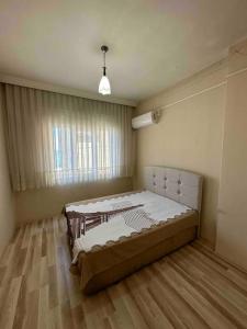 Postel nebo postele na pokoji v ubytování Müstakil Ev Trabzon Merkez