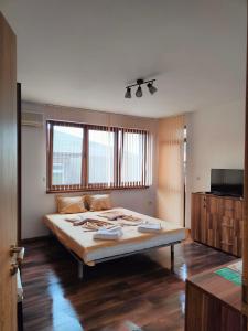 a bedroom with a large bed in a room at M&D in Nesebar